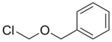 ((Chloromethoxy)Methyl)Benzene